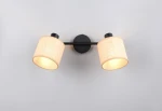 Lampa sufitowa Aimee w kolorze czarnym z dwoma abażurami w naturalnym odcieniu. Ujęcie frontalne, prezentujące lampę zamontowaną na ścianie, z widocznym ciepłym światłem emitowanym przez abażury. Metalowa konstrukcja z tekstylnymi kloszami.
