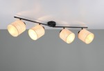 Czarna lampa sufitowa Aimee z czterema reflektorami E14, w naturalnych kloszach z plecionki. Ułożona na czarnej metalowej belce, zamontowana na suficie. Klosze emitują ciepłe światło, tworząc przytulną atmosferę.