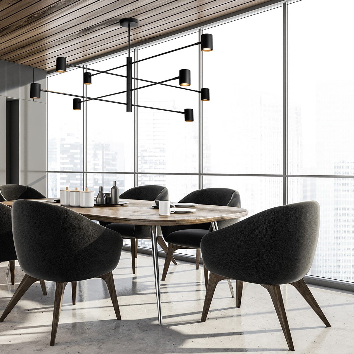 Lampa wisząca Snow LP-731/8P BK w kolorze czarnym, z ośmioma miejscami na żarówki GU10, zawieszona w nowoczesnej aranżacji nad okrągłym drewnianym stołem. Widoczna w przestronnym wnętrzu z dużymi oknami i eleganckimi krzesłami.