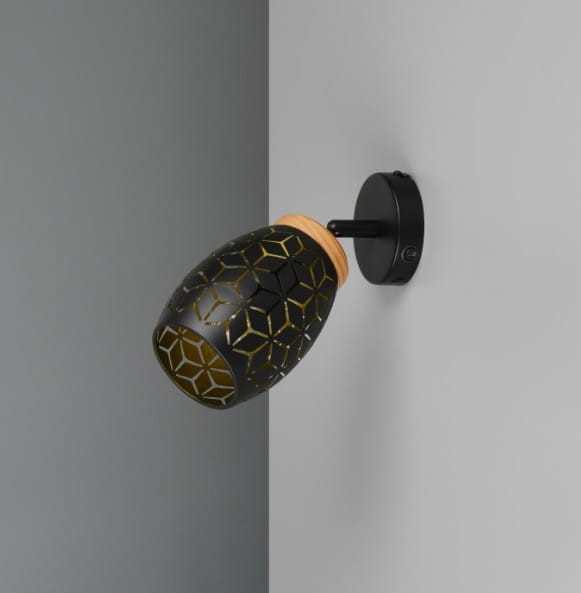 Kinkiet Bidar w kolorze czarnym z żółtym wzorem geometrycznym, wykonany z metalu i szkła, zamocowany na okrągłej podstawie. Lampa w kształcie owalnym, pod kątem do ściany, z widocznym gniazdem E14.