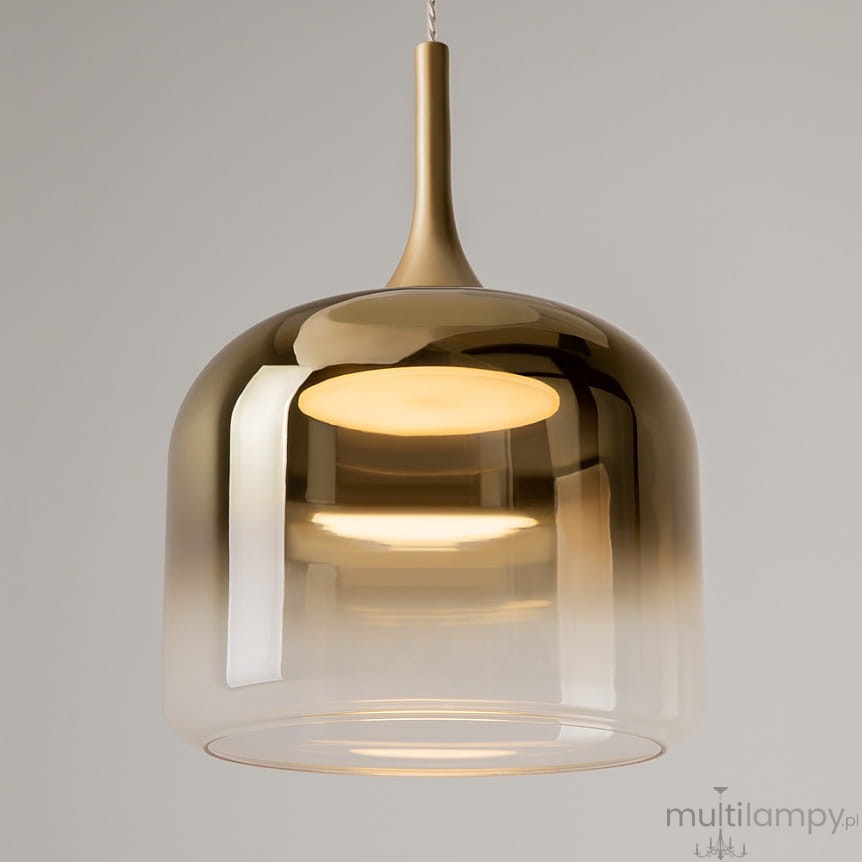 Lampa wisząca Spirito LED/12W w kolorze złotym, o szklanym kloszu z gradientem od przezroczystego do złotego. Ujęcie z dołu, pokazujące gładką, zaokrągloną formę oraz źródło światła wewnątrz klosza.