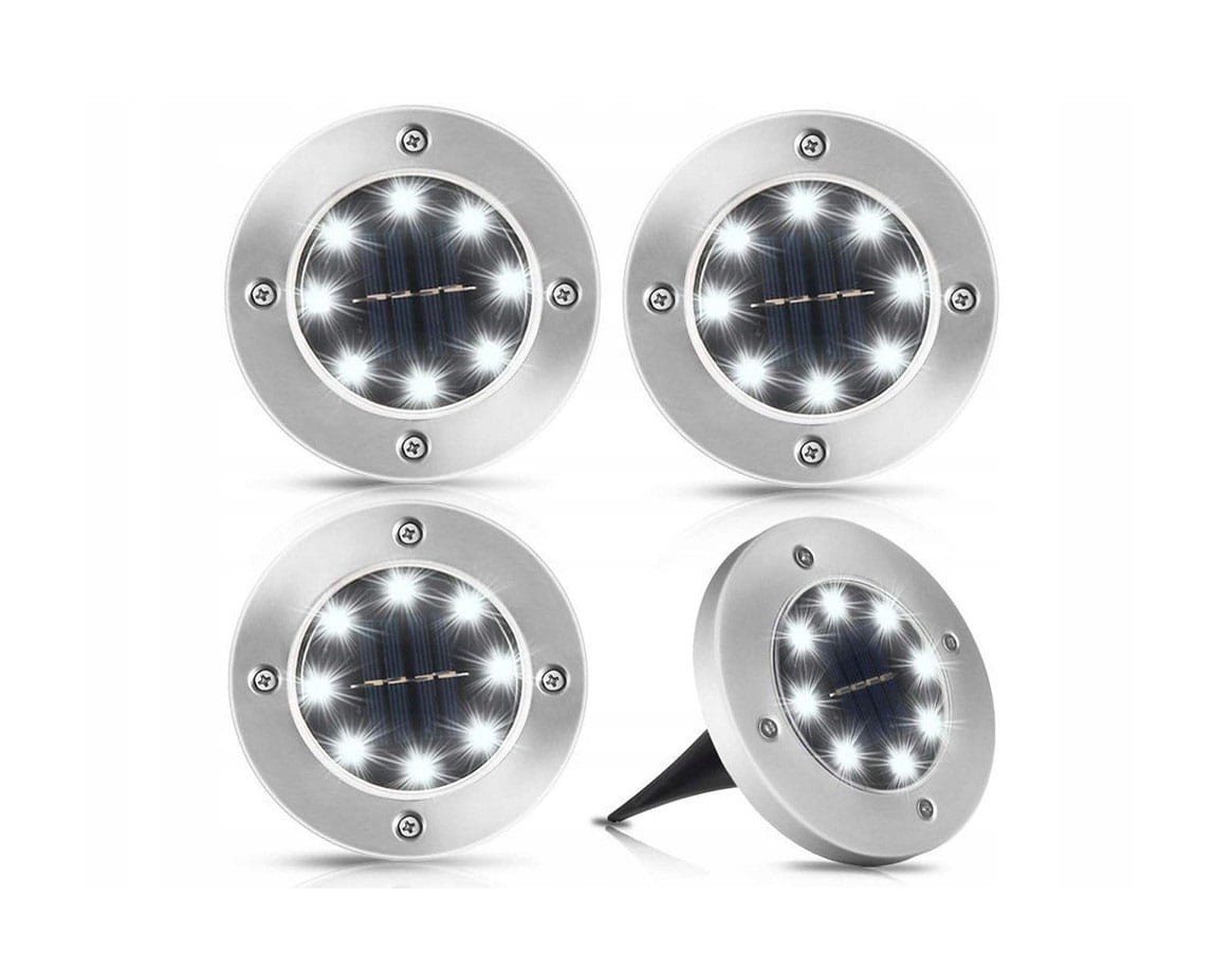 Zestaw 4 sztuk lamp solarnych ogrodowych Terra, wbijanych, o okrągłym kształcie, srebrnej obudowie z widocznymi diodami LED. Lampa ma możliwość montażu w ziemi, idealna do oświetlenia ścieżek lub ogrodów.