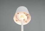 Lampa stołowa zewnętrzna Diaz w kolorze białym, widok od dołu. Na zdjęciu widoczne diody LED oraz elementy elektroniczne na podstwie. Lampa ma prosty, cylindryczny kształt z białą obudową i wbudowane źródło światła o mocy 1,6W.