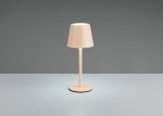 Lampa stołowa zewnętrzna Diaz w kolorze piaskowym, z okrągłą podstawą i cylindrycznym kloszem. Ujęcie frontalne, lampa stoi na gładkiej powierzchni. Źródło światła LED 1,6W zapewnia ciepłe oświetlenie.