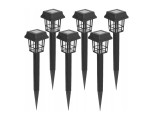 Zestaw sześciu czarnych lamp solarnych ogrodowych wbijanych, z metalowymi kloszami w formie latarni. Każda lampa ma prostą, smukłą podstawę i kwadratowy panel słoneczny na górze. Ujęcie z przodu, wszystkie lampy stoją w pionie na jednolitym tle.