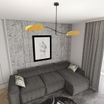 Lampa sufitowa Lotus w kolorze czarnym i pomarańczowym z dwoma kloszami E14, zamontowana na cienkim metalowym ramieniu. Ujęcie z góry, w nowoczesnym wnętrzu z szarymi ścianami i ciemnoszarym narożnikiem.