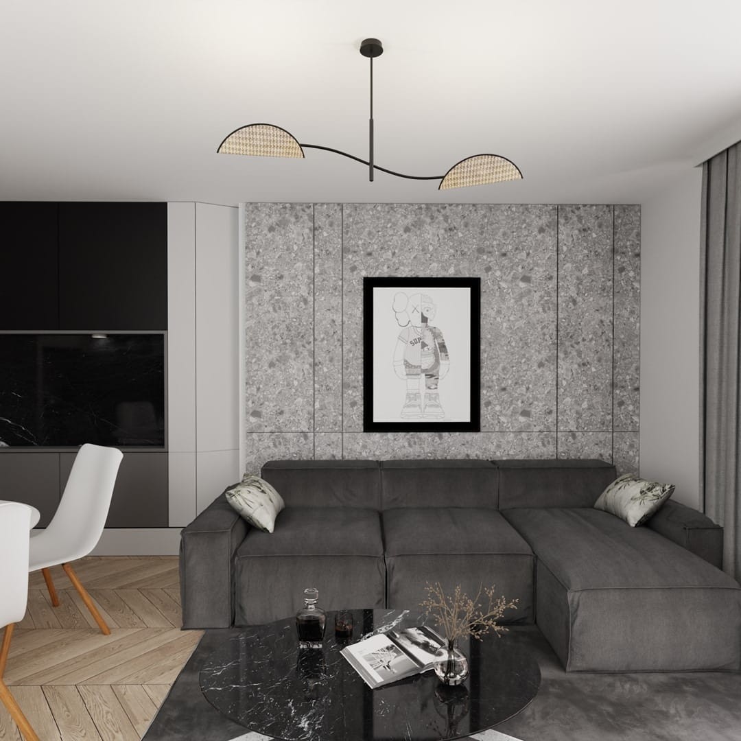 Czarna lampa sufitowa Lotus 2xE14 z naturalnymi kloszami w kształcie półksiężyca, zawieszona pod sufitem w nowoczesnym wnętrzu. Widoczna w aranżacji z szarym narożnikiem, czarnym stołem i grafiką na ścianie.