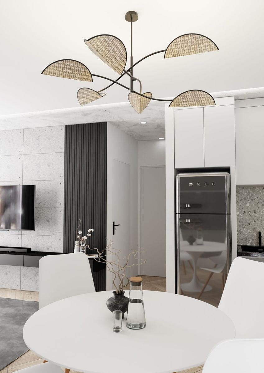 Czarna lampa sufitowa Lotus z sześcioma kloszami E14 w naturalnym kolorze, umieszczona w kuchni. Klosze mają kształt liści, a całość jest zawieszona na cienkim metalowym ramieniu.