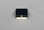Kinkiet zewnętrzny Olinda w kolorze czarnym, z panelem solarnym i czujnikiem ruchu, z 1 diodą LED o mocy 2,5W. Produkt leżący na jasnym tle, z widocznym panelem słonecznym na górze i źródłem światła na dole.