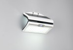 Kinkiet zewnętrzny solarny Macapa w kolorze białym, montowany na ścianie, z czujnikiem ruchu i zmierzchu. Posiada panel LED o mocy 5W, z gładką, teksturowaną powierzchnią oraz widocznym przyciskiem. Ujęcie frontalne.