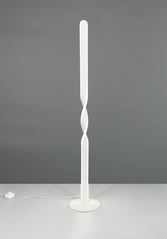 Lampa podłogowa Ginko w kolorze białym, z metalowym okrągłym podstawą i smukłym, spiralnym korpusem. Kąt ujęcia frontalny, produkt leży na stole. Widoczny kabel z włącznikiem. Działa na 1xLED 19W.