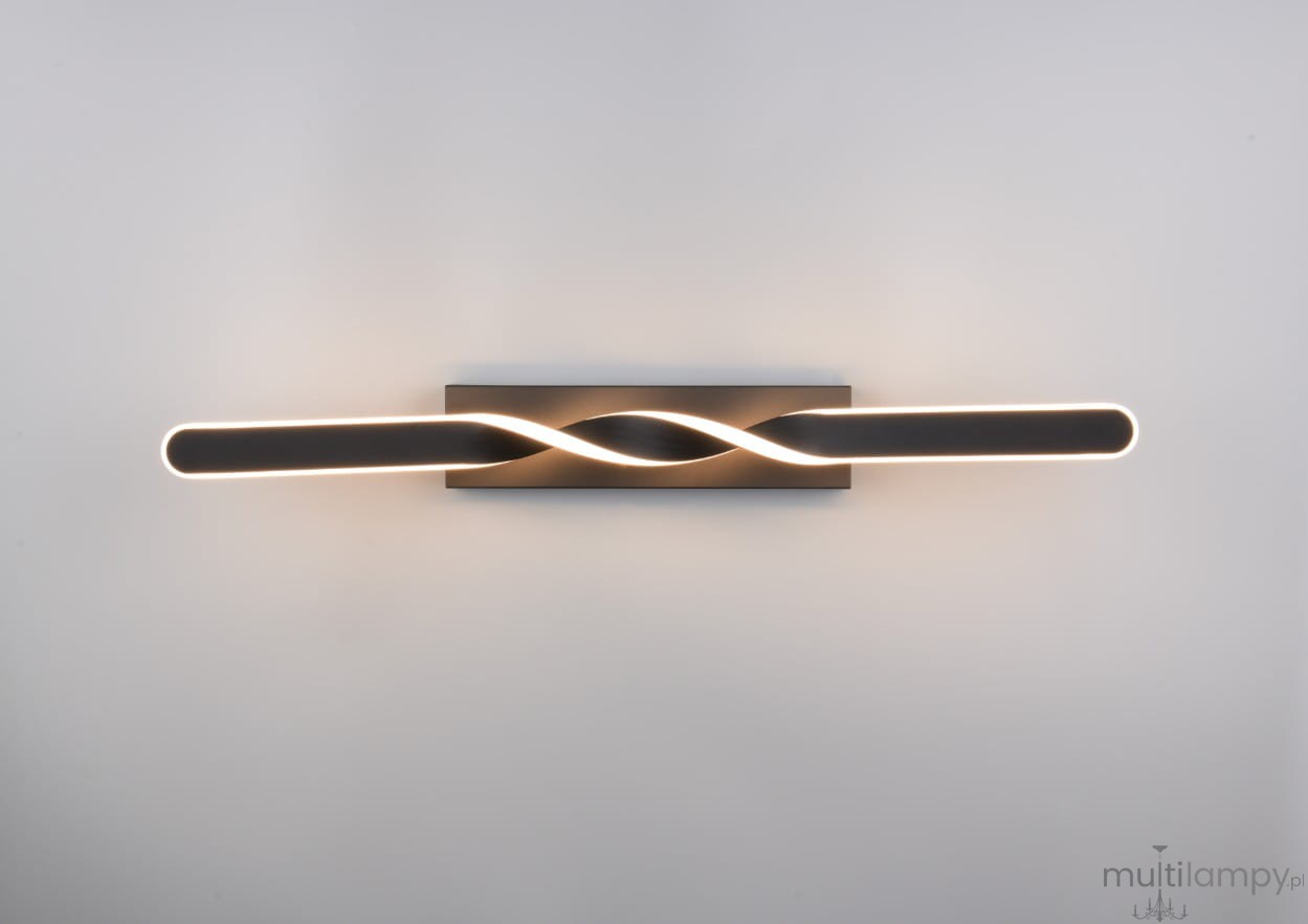 Lampa sufitowa Ginko w kolorze czarnym, z jedną diodą LED o mocy 18W. Wyróżnia się podłużnym kształtem z falującym wzorem oraz subtelnym podświetleniem. Montaż na ścianie lub suficie, widoczny na jednolitym tle.