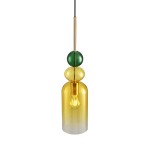 Lampa wisząca Pastello 1xE27 w kolorze złotym i żółtym, wykonana z transparentnego szkła. Ma okrągłe, kolorowe elementy dekoracyjne: zieloną kulę oraz żółte półkulę. Zawieszona na czarnym kablu, podświetla żarówkę.