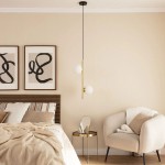 Lampa wisząca Bari-Milano 2xE27 w kolorze złotym, zawieszona na czarnym przewodzie. Posiada dwa białe, okrągłe klosze i proste, minimalistyczne wzornictwo. Zawieszona w nowoczesnej sypialni z jasnymi ścianami i drewnianymi elementami.