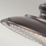 Lampa wisząca Redding Station w kolorze brązowym, z oprawą w kształcie klosza. Widoczna tekstura klosza oraz detal mocowania. Produkt przeznaczony do użytku ogrodowego z gniazdem E27. Ujęcie z boku, pokazujące detale konstrukcyjne.