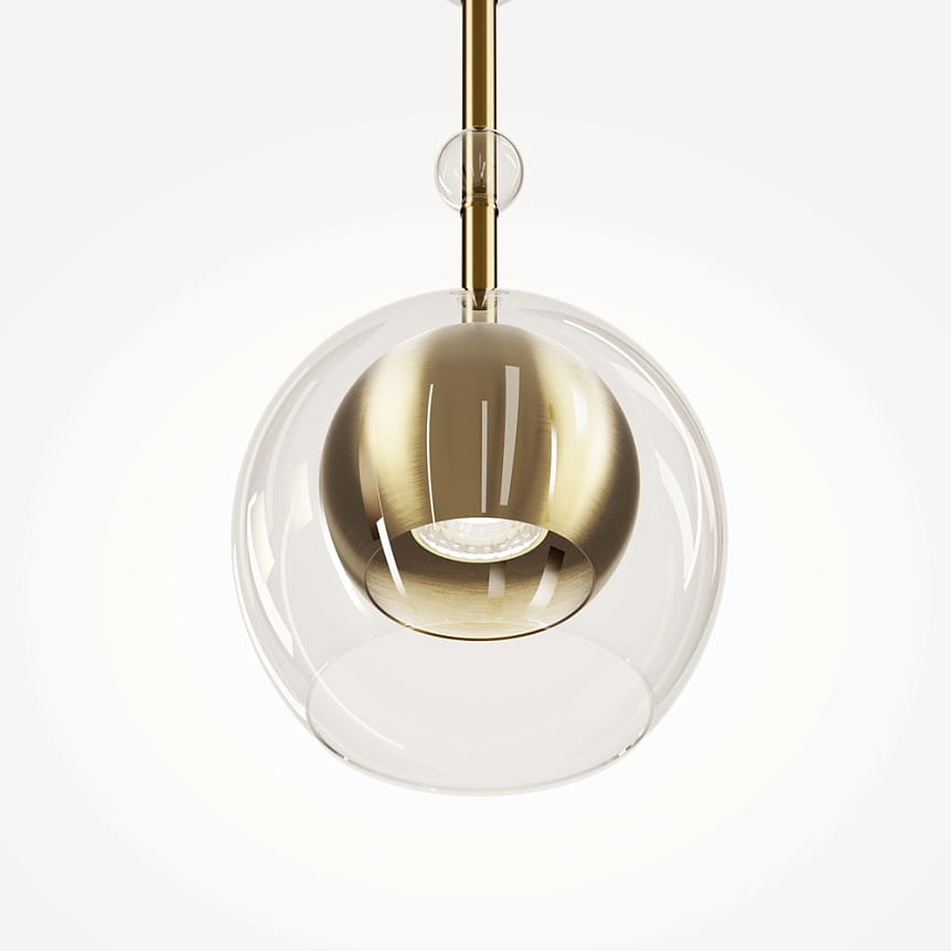 Lampa wisząca Ross z mosiężnym kloszem i transparentnym szkłem, w kształcie kuli. Zawieszona na metalowym stelażu, z widocznym źródłem światła GU10. Prosty, elegancki design, idealna do nowoczesnych wnętrz.