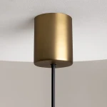 Lampa wisząca LED The Sixth Sense o mocy 7W i temperaturze barwowej 3000K w kolorze mosiądzu. Widziana z bliska, z cylindrycznym kloszem i czarnym przewodem, montowana do sufitu, na tle jasnej powierzchni.