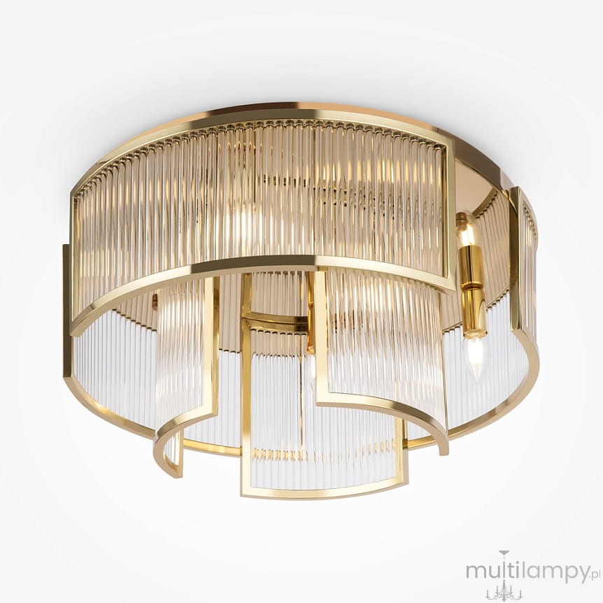Lampa sufitowa Frame z sześcioma miejscami na żarówki E14, w kolorze złotym. Okrągła konstrukcja z przezroczystymi, pionowymi przesłonami, układającymi się w faliste wzory. Ujęcie z góry, na białym tle.