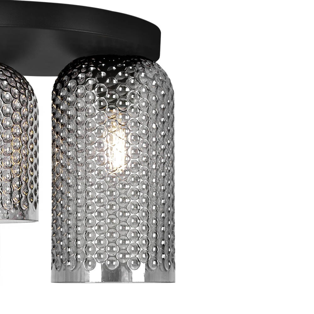 Lampa sufitowa Inga w kolorze czarnym z grafitowym wykończeniem, z dwoma kloszami o zaokrąglonym kształcie, wykonanymi z przezroczystego materiału z fakturą bąbelków. Widoczny gwint E27, zamontowana poziomo na okrągłej podstawie.