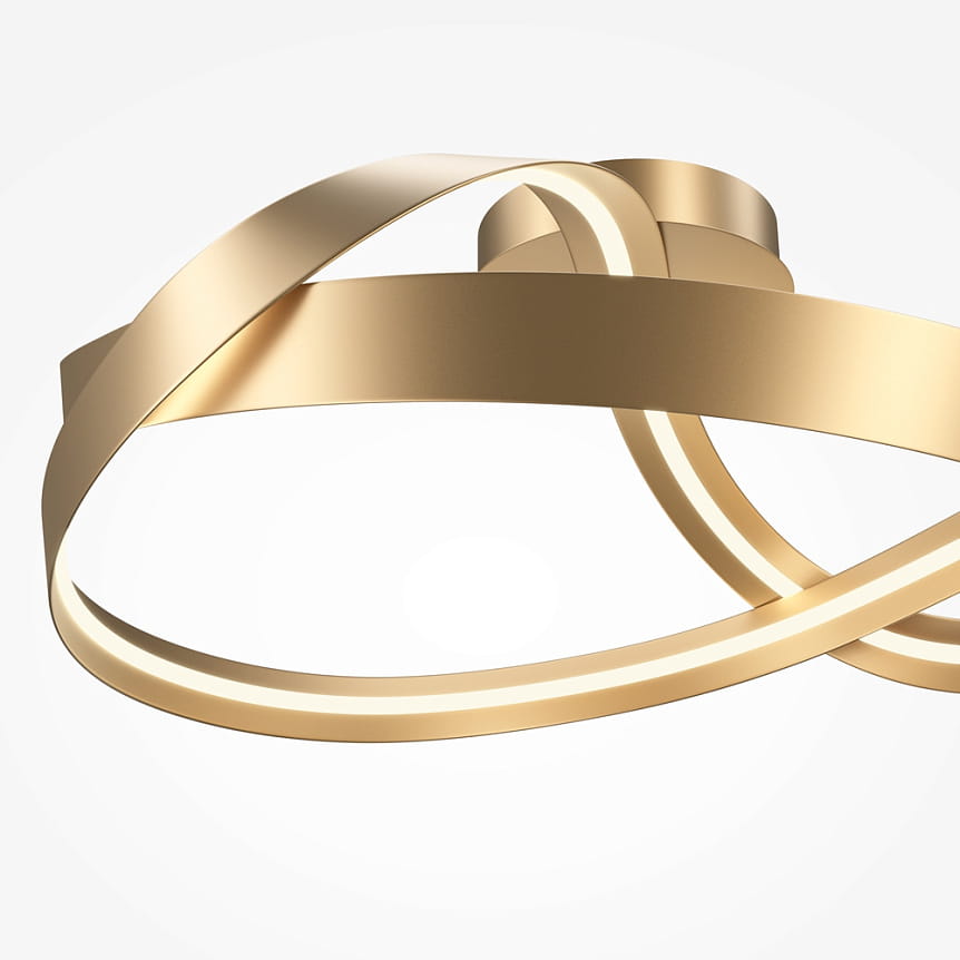 Lampa sufitowa LED o mocy 34W w kolorze mosiądzu, z nowoczesnym, spiralnym kształtem. Wykończenie z błyszczącego metalu, z wbudowanym oświetleniem wzdłuż krawędzi. Ujęcie z góry, ukazujące detale konstrukcji.