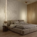 Lampa wisząca LED Halo H60 w kolorze mosiądzu, z trzema długimi, smukłymi elementami, zawieszona nad łóżkiem w sypialni. Tło z teksturą ściany i drewnianą ścianką, zapewniające nowoczesny wygląd aranżacji.