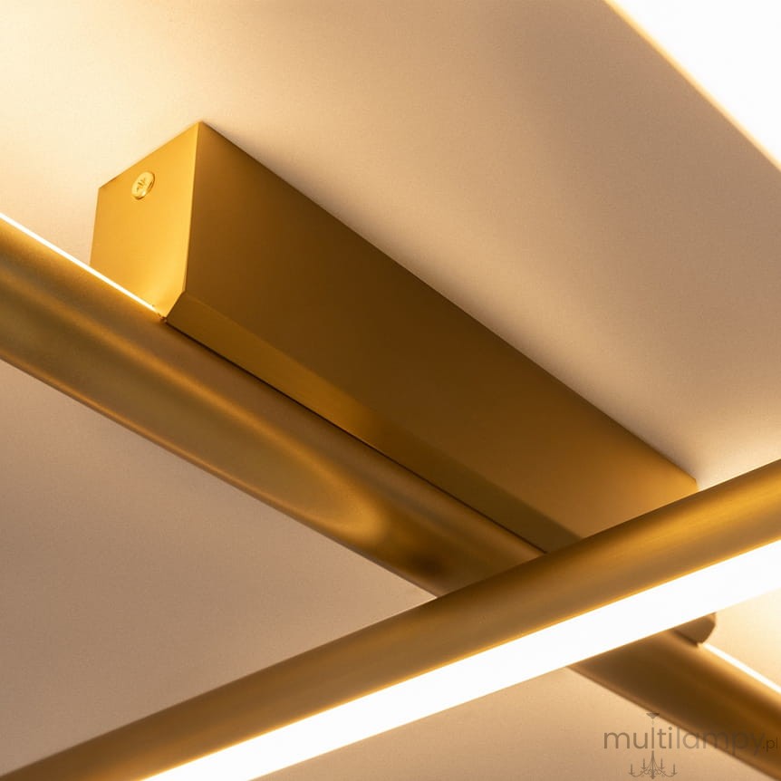 Lampa wisząca LED Radiance w kolorze złotym, moc 80W, temperatura barwowa 3000K. Widoczny element montażowy oraz metalowe ramiona w kształcie prostokątnym, zawieszone pod kątem, z emitującym światło paskiem LED.
