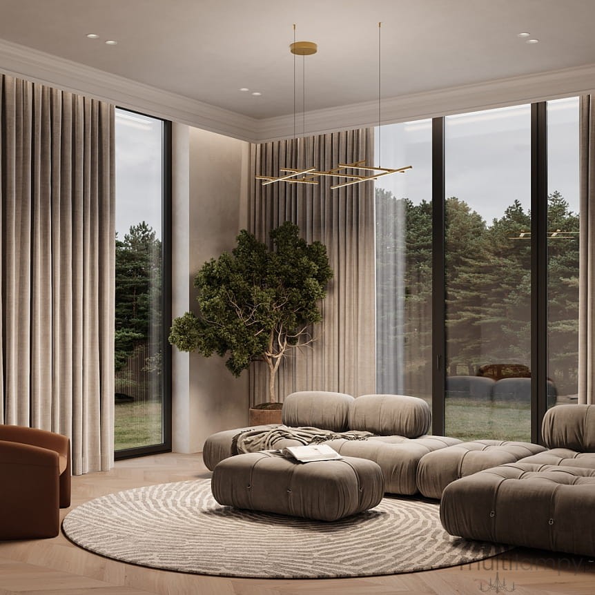 Złota lampa wisząca LED Radiance o mocy 80W i temperaturze barwowej 3000K, zawieszona na cienkich linkach, prezentująca nowoczesny design w jasnym wnętrzu z dużymi oknami i roślinnością.