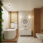 Kinkiet Halo 1xG9 IP44 w kolorze czarnym, zamontowany na ścianie, z okrągłym kloszem. Oświetlenie znajduje się w nowoczesnej łazience, obok lustra i umywalki, na tle jasnych płytek i drewnianych elementów.