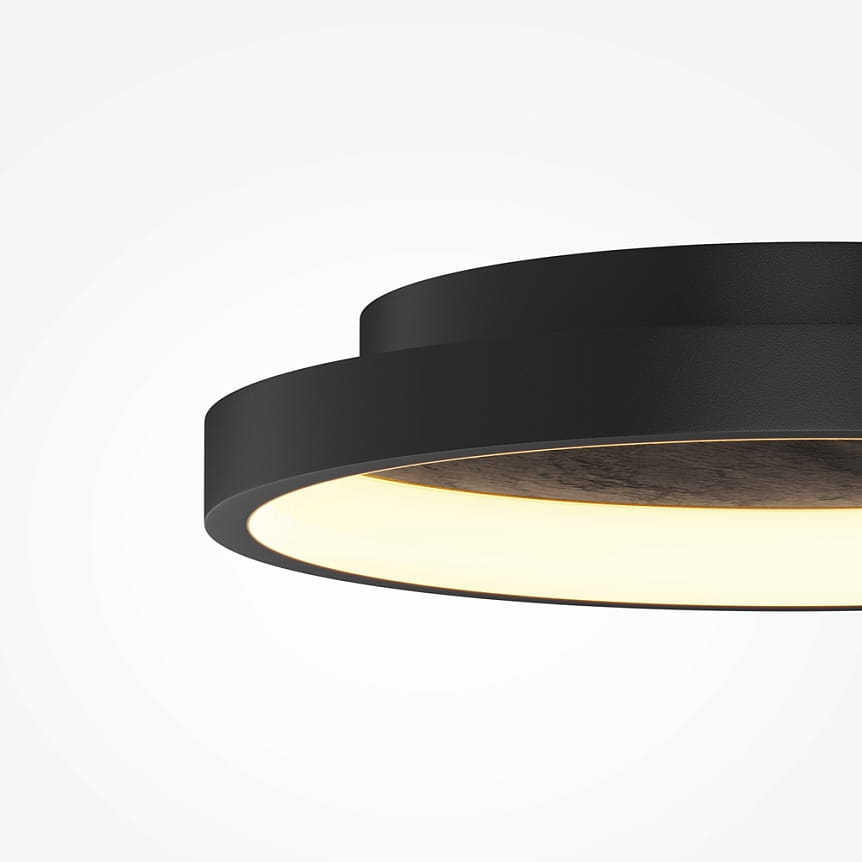 Lampa sufitowa LED Orign o mocy 40W, kolor czarny. Okrągła forma z matowym wykończeniem, wyposażona w ciepłe światło (3000K). Widok z boku, ukazujący szczegóły konstrukcji oraz jasne wnętrze lampy. Idealna do nowoczesnych wnętrz.