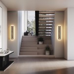 Kinkiet LED Orign MOD311WL-L55B3K w kolorze czarnym, o mocy 55W i temperaturze barwowej 3000K. Montowany na ścianie, w prostokątnym kształcie, z delikatnym podświetleniem wzdłuż krawędzi, umieszczony obok schodów w nowoczesnym wnętrzu.