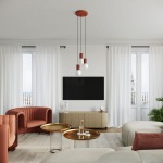 Lampa wisząca Halo w kolorze ochry czerwonej z trzema źródłami światła G9. Zawieszona na czarnych przewodach z okrągłym, czerwonym sufitem. Produkt umieszczony w nowoczesnym wnętrzu z jasnymi zasłonami i minimalistycznymi meblami.