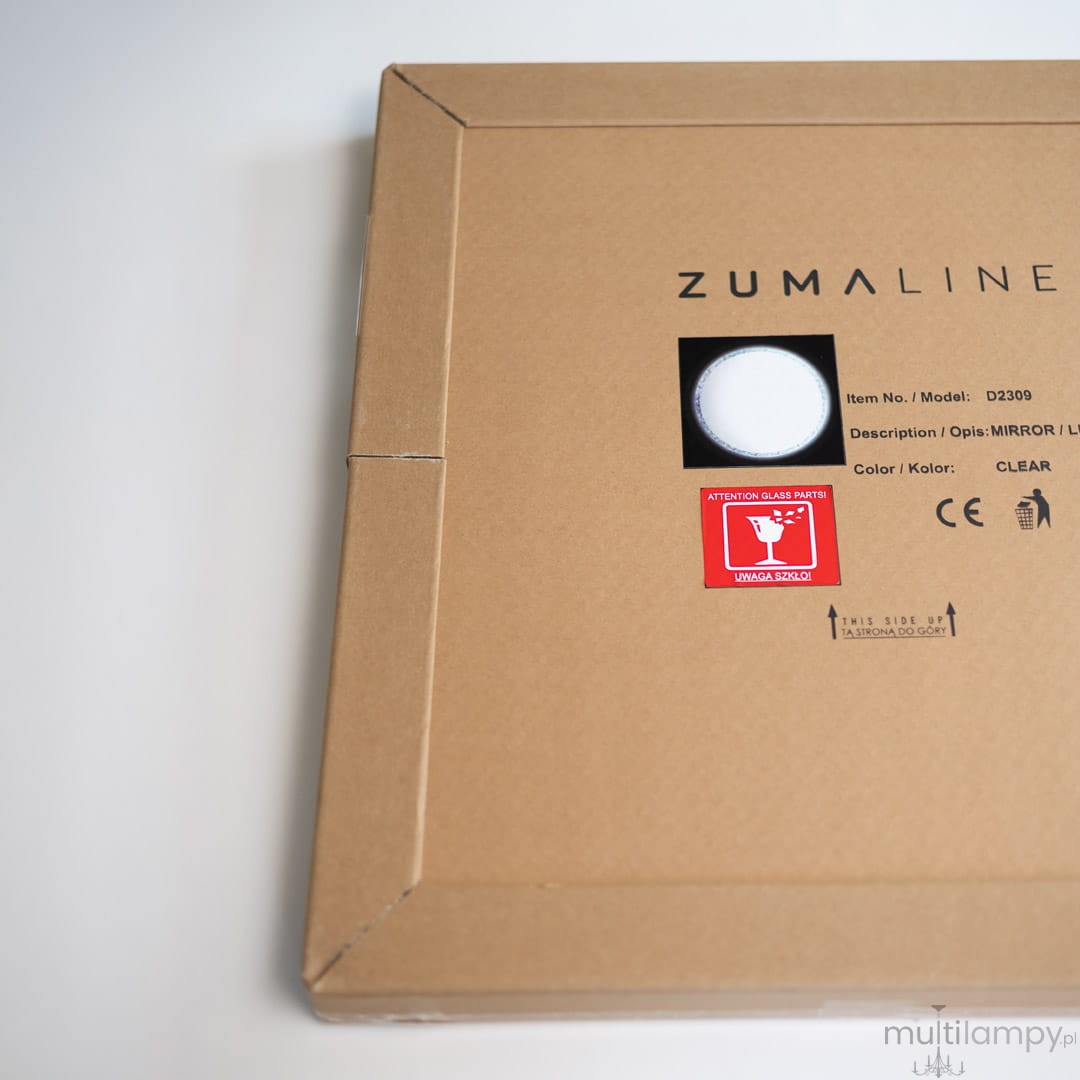 Lustro podświetlane D60 w kształcie koła, LED 24W CCT, z kryształowym wykończeniem. Widoczne oznaczenia i etykieta na opakowaniu, jasne tło, kolor przezroczysty. Opakowanie z oznaczeniem uwaga szkło.
