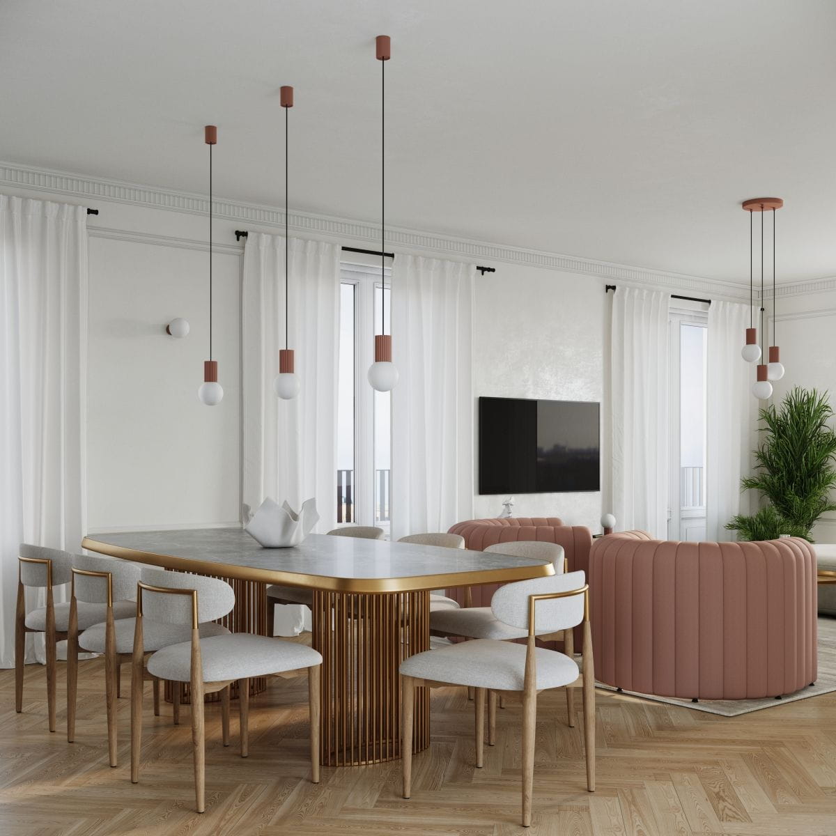 Lampa wisząca Halo z trzema źródłami światła G9 w kolorze miedzi, zawieszona na czarnych linkach. Produkt umieszczony w nowoczesnej aranżacji jadalni z okrągłym stołem i jasnymi krzesłami. W tle widoczny telewizor oraz rośliny.