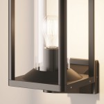 Kinkiet elewacyjny Cell w kolorze grafitowym z jednym gniazdem E27. Produkt ma prostokątną podstawę z matowego metalu, osłonę ze szkła oraz widoczną żarówkę. Ujęcie z boku, prezentujące detale konstrukcyjne i stylowy design.