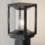 Lampa ogrodowa Cell H75 w kolorze grafitowym, stojąca, z kloszem ze szkła i metalową podstawą. Widoczna żarówka E27. Produkt w detalu, z kroplami wody na powierzchni, co sugeruje odporność na warunki atmosferyczne.