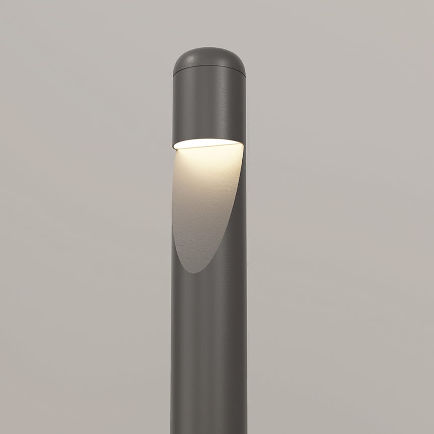 Grafitowa lampa ogrodowa LED Hagen H60 o mocy 5W, emitująca ciepłe światło 3000K. Ujęcie z góry, pokazujące cylindryczny kształt i lekko zaokrągloną głowicę z wykończeniem matowym. Wbudowane źródło światła skierowane w dół.