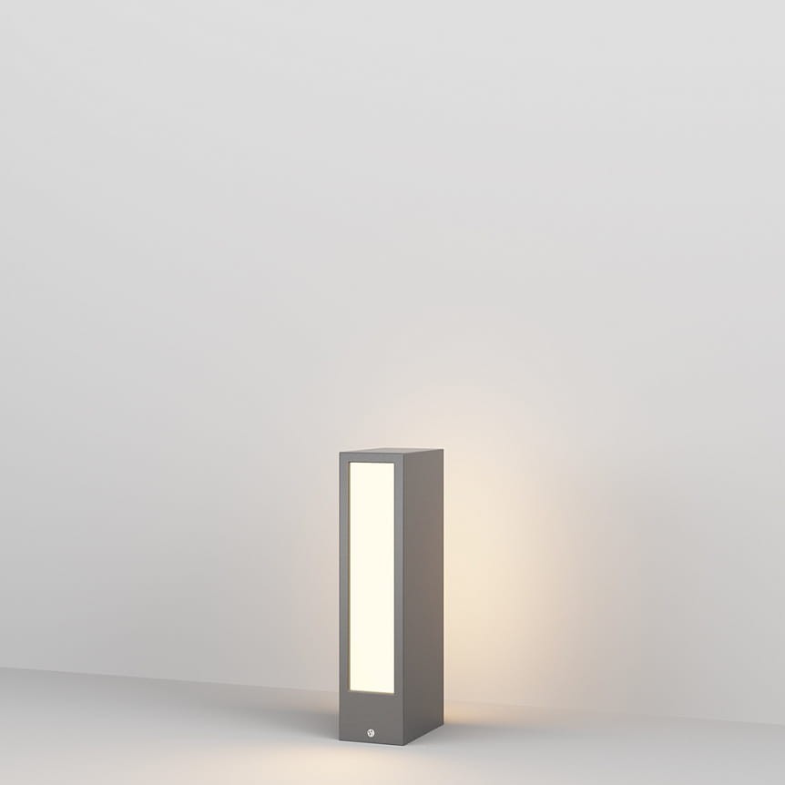 Lampa ogrodowa LED Hof H25 w kolorze grafitowym, o mocy 6W i temperaturze barwowej 3000K. Ma prostokątny kształt z białym panelem świetlnym z przodu, ustawiona pionowo na gładkiej powierzchni, tło w jasnym kolorze.