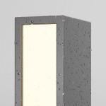 Lampa ogrodowa LED Hof H25, moc 6W, kolor grafitowy. Prostokątna konstrukcja z przezroczystym panelem, lekko wilgotna, z widocznymi kroplami wody. Źródło światła o ciepłej barwie 3000K, ustawiona w pionie na jednolitym tle.