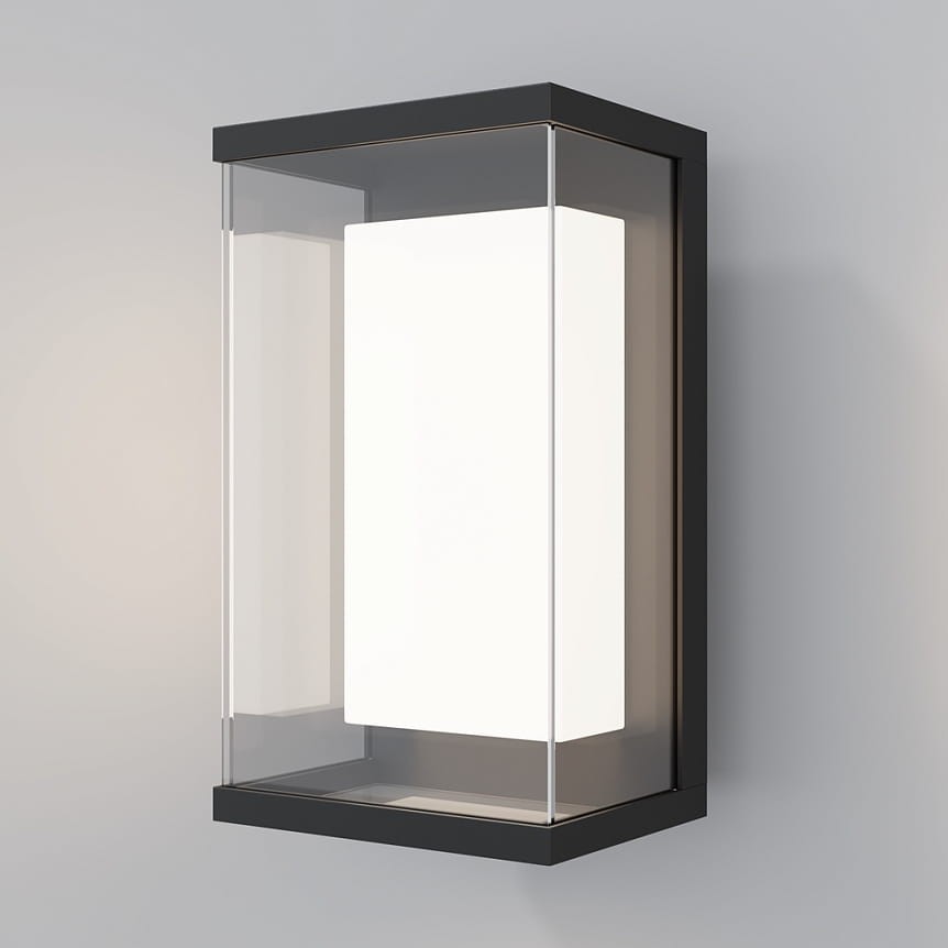 Kinkiet elewacyjny LED Baker Street 10W 3000K w kolorze czarnym. Prosta, kwadratowa obudowa z przezroczystym szkłem, w kształcie prostokąta. Montowany na ścianie, z widocznym źródłem światła wewnątrz.