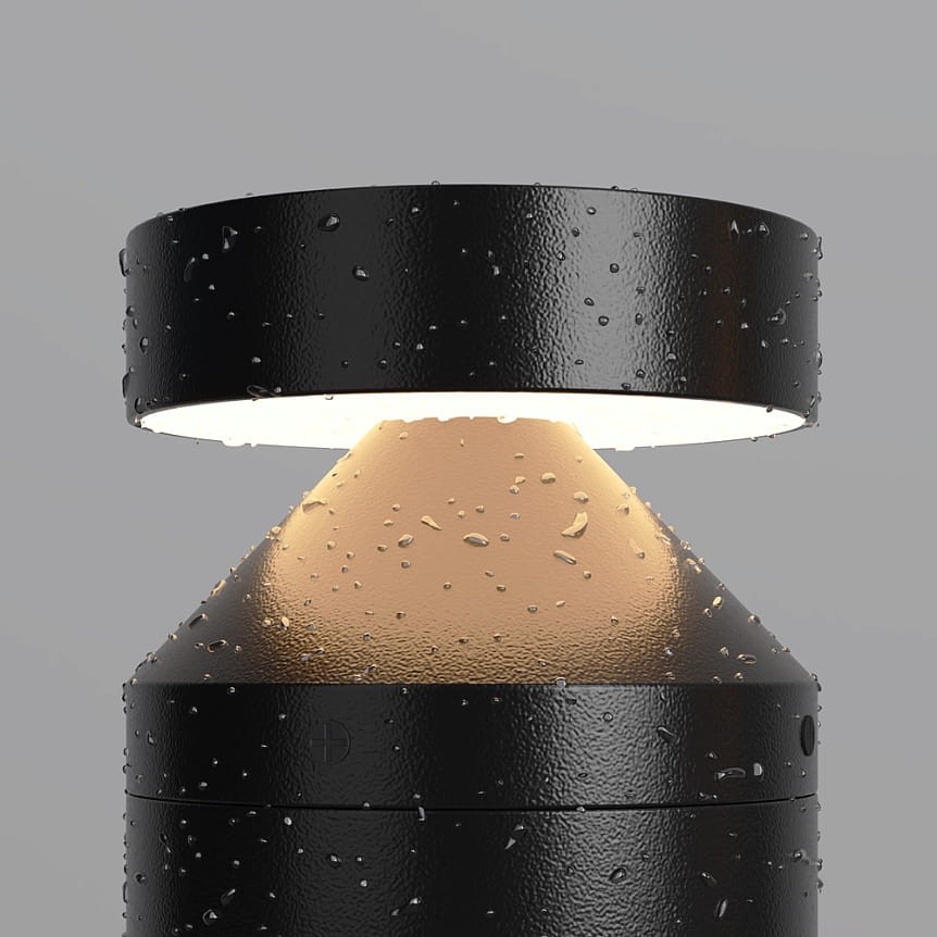 Lampa ogrodowa LED Olten H30, grafitowa, z okrągłym kloszem i stożkowatą podstawą. Wodoodporna, z widocznymi kroplami wody na powierzchni. Emituje ciepłe światło 3000K, idealna do oświetlenia przestrzeni na zewnątrz.