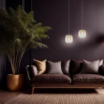 Lampa wisząca LED Vaso 2 l, 4W, 3000K w kolorze złotym i bursztynowym, zawieszona na cienkich linkach, w nowoczesnym wnętrzu z ciemną ścianą, obok brązowej sofy z poduszkami. W tle widoczna roślina doniczkowa.