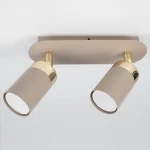Lampa sufitowa Joker w kolorze kaszmiru i złota, z dwoma obrotowymi kloszami GU10. Klosze mają matową powierzchnię, a ich górne części są wykończone w połysku. Produkt montowany na prostokątnej podstawie, widok z góry.