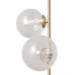 Lampa wisząca Toledo z trzema źródłami światła G9, w kolorze złotym. Posiada przezroczyste, szklane klosze w formie kul, z widocznymi elementami oświetleniowymi. Produkt zawieszony na stalowej konstrukcji, w kształcie prostym.