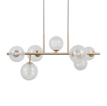 Lampa wisząca Toledo z siedmioma kulistymi kloszami z przezroczystego szkła, zawieszona na złotej metalowej podstawie. Klosze mają różne wzory i tekstury, co nadaje całości nowoczesny wygląd. Produkt zawieszony na dwóch cienkich linkach.