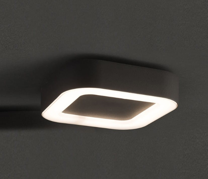 Plafon elewacyjny ścienny LED Stella 12W w kolorze czarnym. Posiada prostokątny kształt z delikatnym, podświetlonym brzegiem. Zainstalowany na ciemnym tle, zapewnia neutralne światło o temperaturze 4500K.