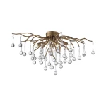 Lampa sufitowa Icicle 4xG9 w postarzanym mosiądzu, z dekoracyjnymi, szklanymi kroplami w różnych kształtach. Ułożona w formie gałęzi, z centralnym uchwytem, wiszące elementy dodają elegancji. Na białym tle dla lepszej widoczności.