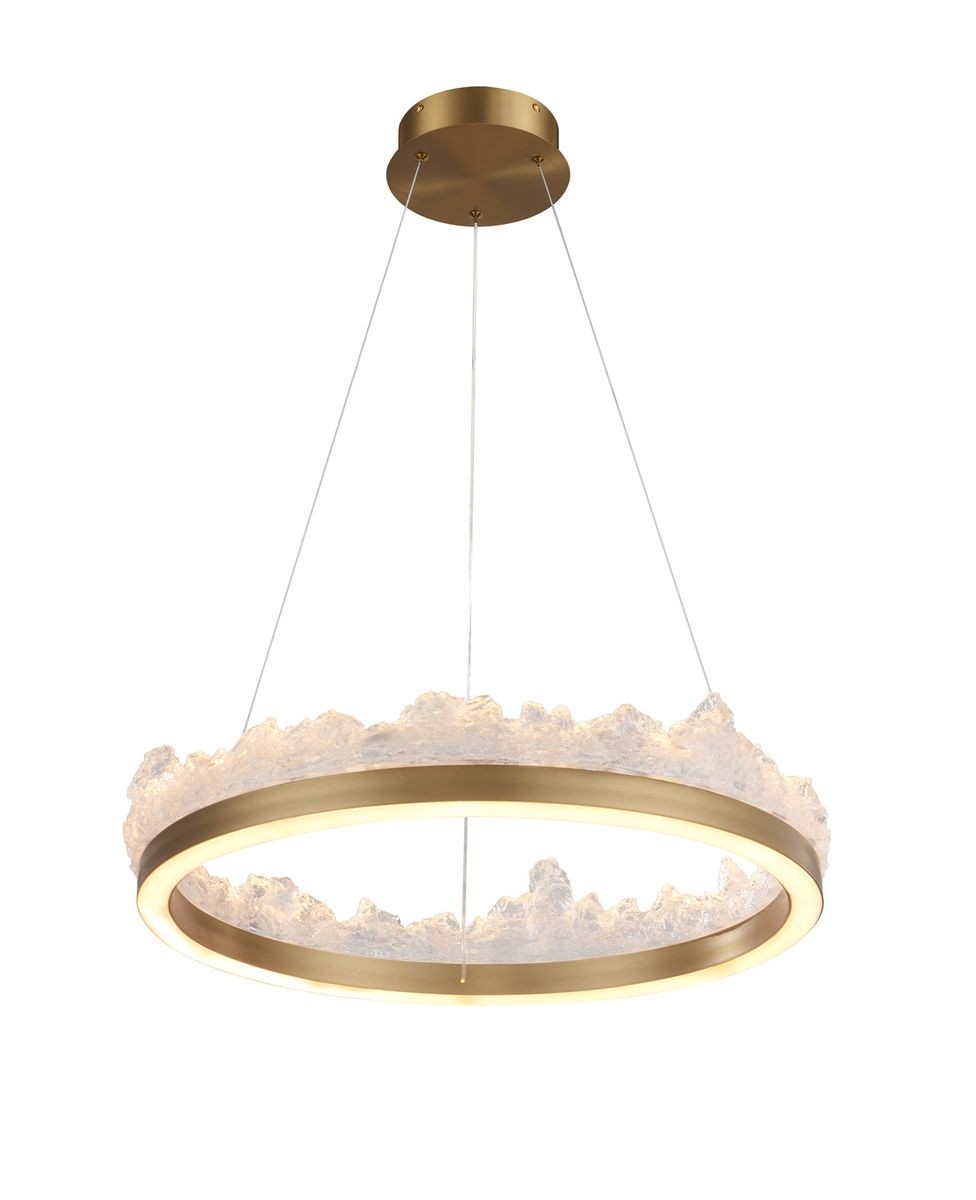 Lampa wisząca LED Montana 26W 3000K w złotym kolorze, o okrągłym kształcie z przezroczystymi, teksturowanymi elementami. Zawieszona na cienkich linkach, z okrągłym metalowym mocowaniem. Idealna do nowoczesnych wnętrz.