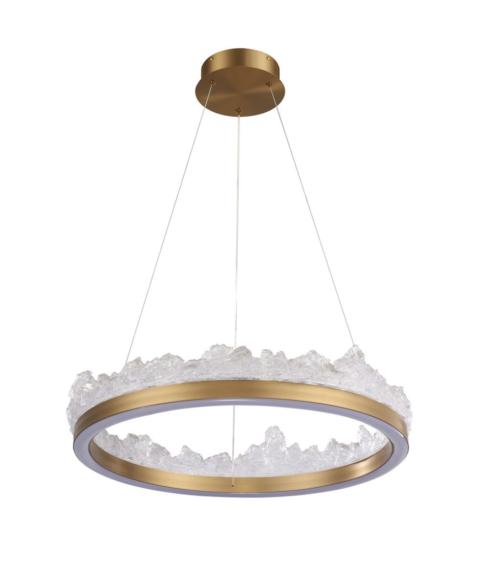 Lampa wisząca LED Montana 26W 3000K w kolorze złotym z przezroczystym, teksturowanym kloszem. Okrągła forma z ozdobnymi, nieregularnymi krawędziami. Zawieszona na cienkich linkach, montowana do sufitu.