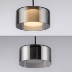 Lampa wisząca Rika 3xLED 18W w kolorze czarnym dymionym. Cylindryczny klosz z przezroczystego szkła, w górnej części z mlecznym wykończeniem. Ujęcie z góry i z dołu, pokazujące dwa warianty oświetlenia. Lampa zawieszona na czarnym przewodzie.
