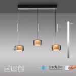 Lampa wisząca Rika z trzema kloszami LED o mocy 18W, w kolorze czarnym dymionym. Klosze mają cylindryczny kształt, zawieszone na cienkich linkach. Wbudowana technologia ściemniania, z przyciskiem sterującym po prawej stronie.